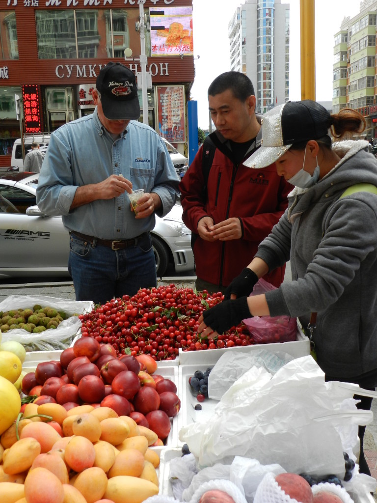 Fruit vendor; note that Luke is eating ice cream in preparation for his fruit
