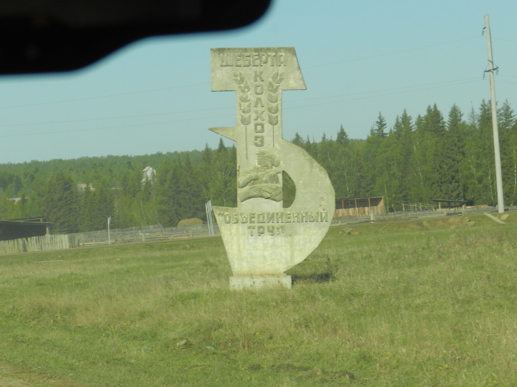 Sign for old collective farm in Sheberta