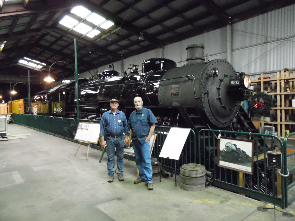 Luke and Mark Mowbray, the Executive Director of the YT next to the restored steam engine